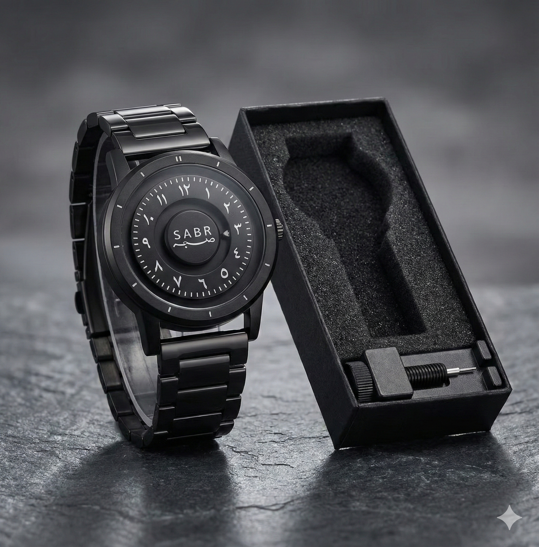 Black wristwatch with 'SABR' branding on a dark surface